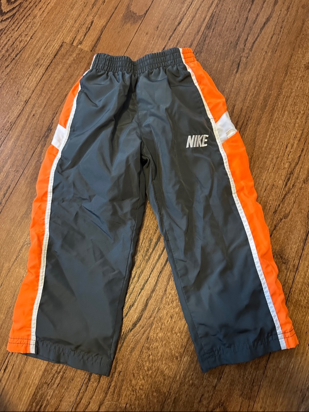 Nike Gray Track Pants with Orange and White Side Stripes